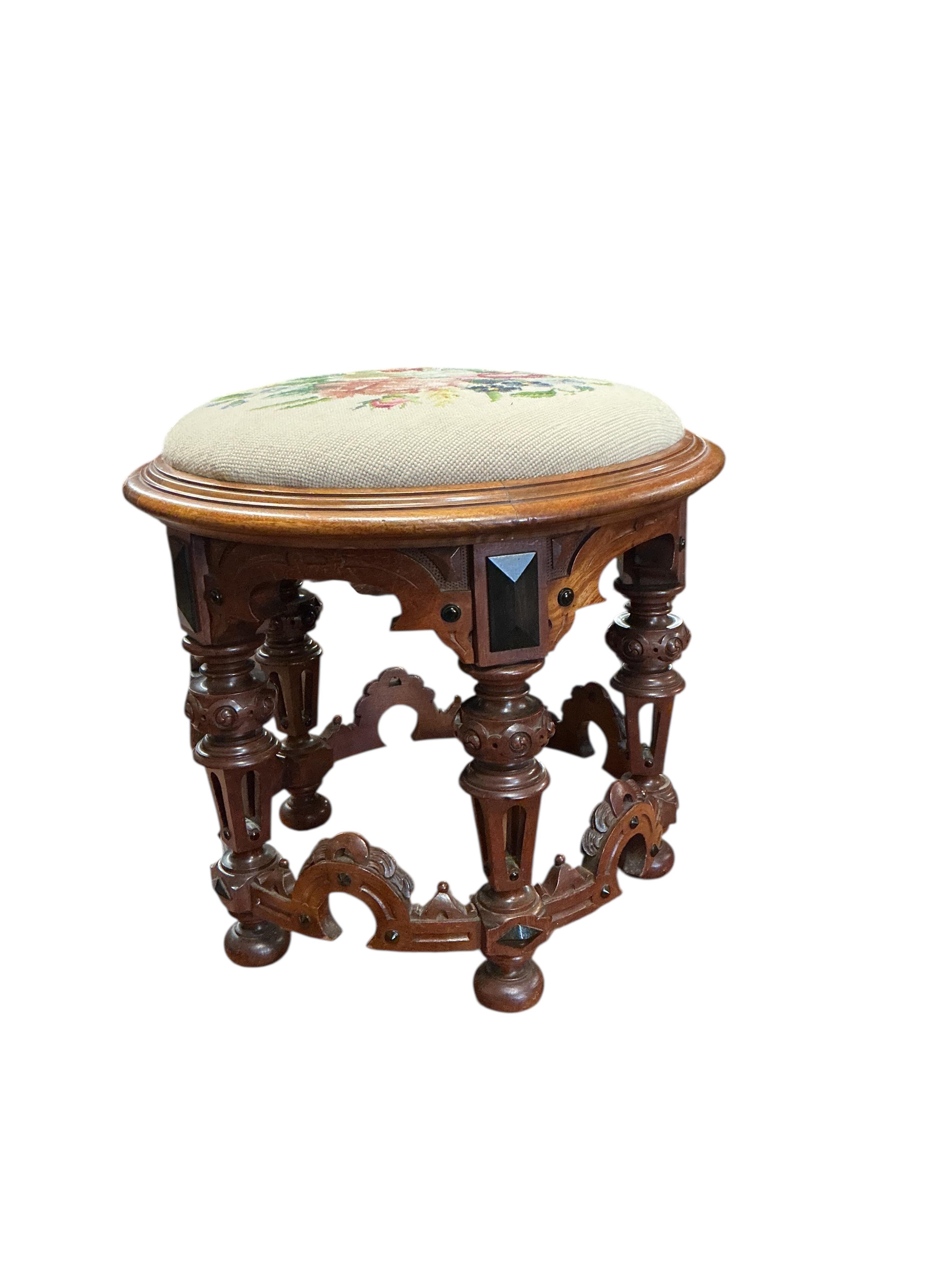 A Victorian circular mahogany stool with drop-in tapestry seat, diameter 48cm, height 44cm